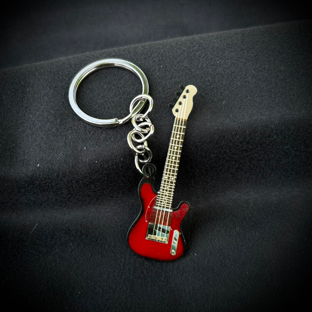 Llavero de guitarra en estampado de color de acero inoxidable al por mayor